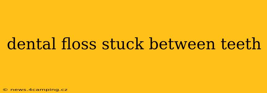 dental floss stuck between teeth
