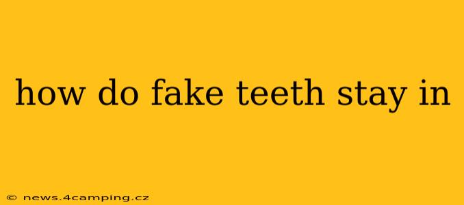 how do fake teeth stay in