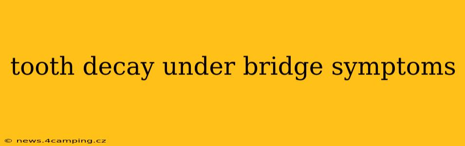 tooth decay under bridge symptoms