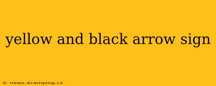 yellow and black arrow sign